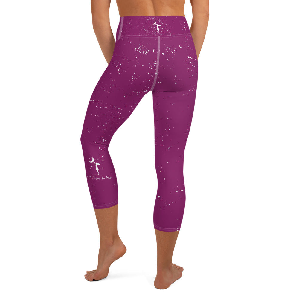 rear view of a barefoot woman wearing mauve colored yoga pants with white flecks