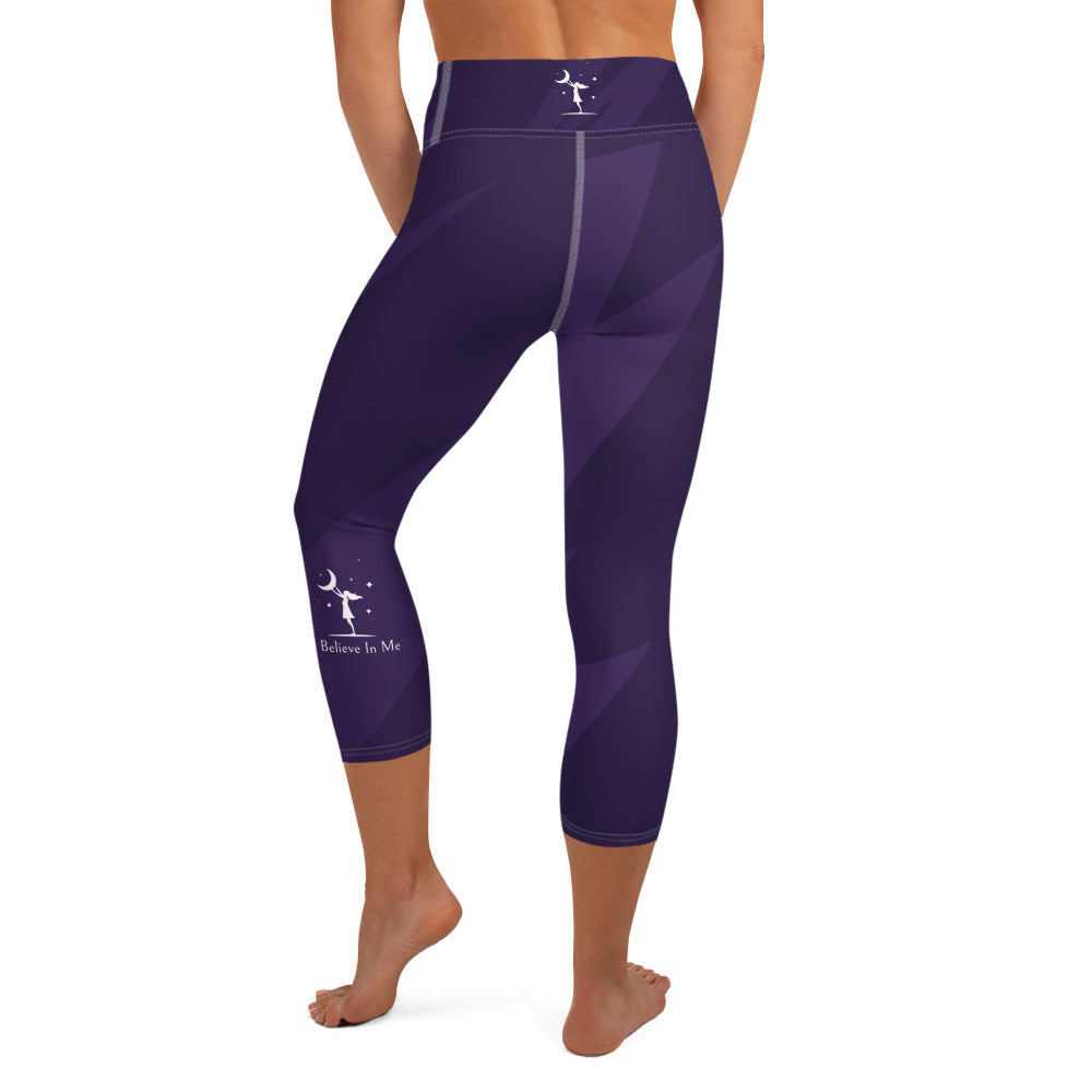 rear view of a barefoot woman wearing purple capri length yoga pants 