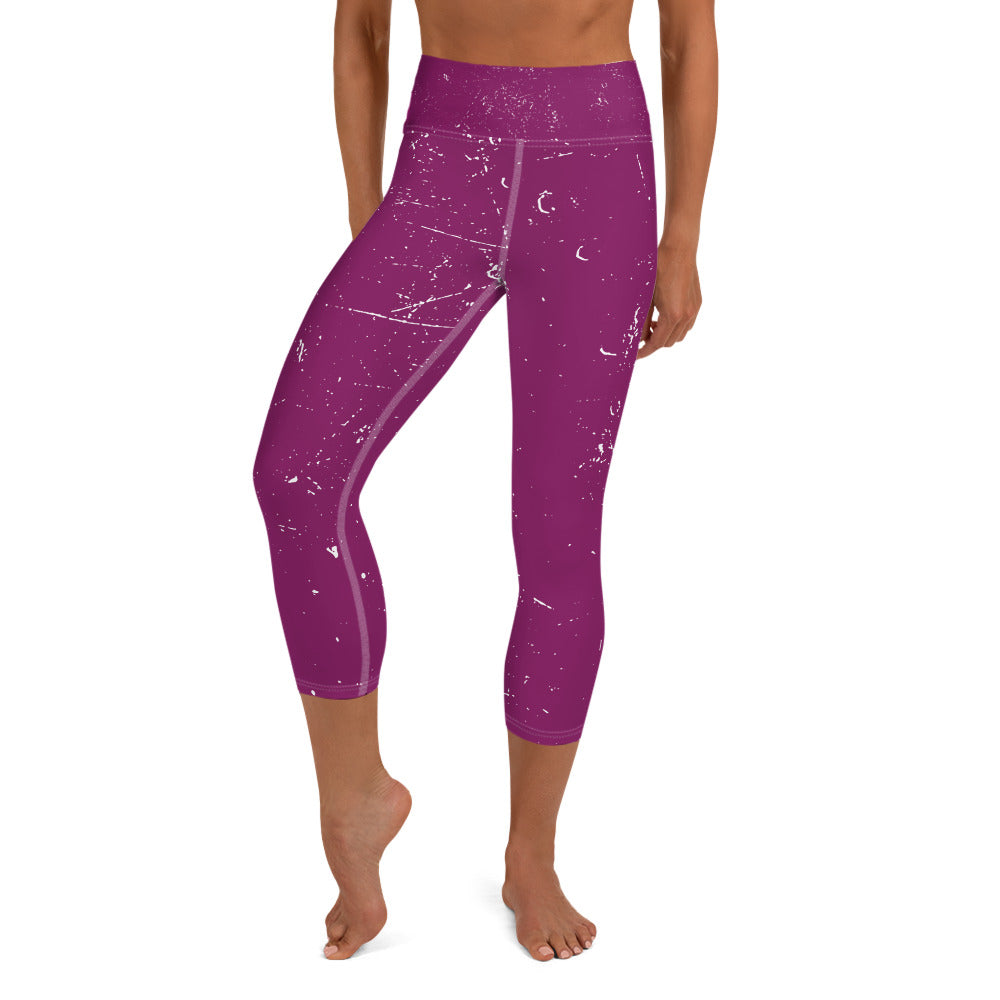 front view of a barefoot woman wearing mauve colored yoga pants with white flecks